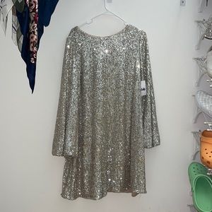 new with tags, sequins going out dress, looser fit , can fit m to xl
